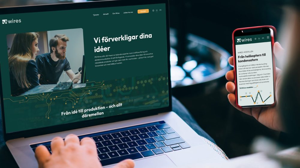 Back Close up of caucasian young man holding blank display mobile phone in hands, verification of banking data, shopping online on laptop computer and cellphone with mock up screen for web advertising